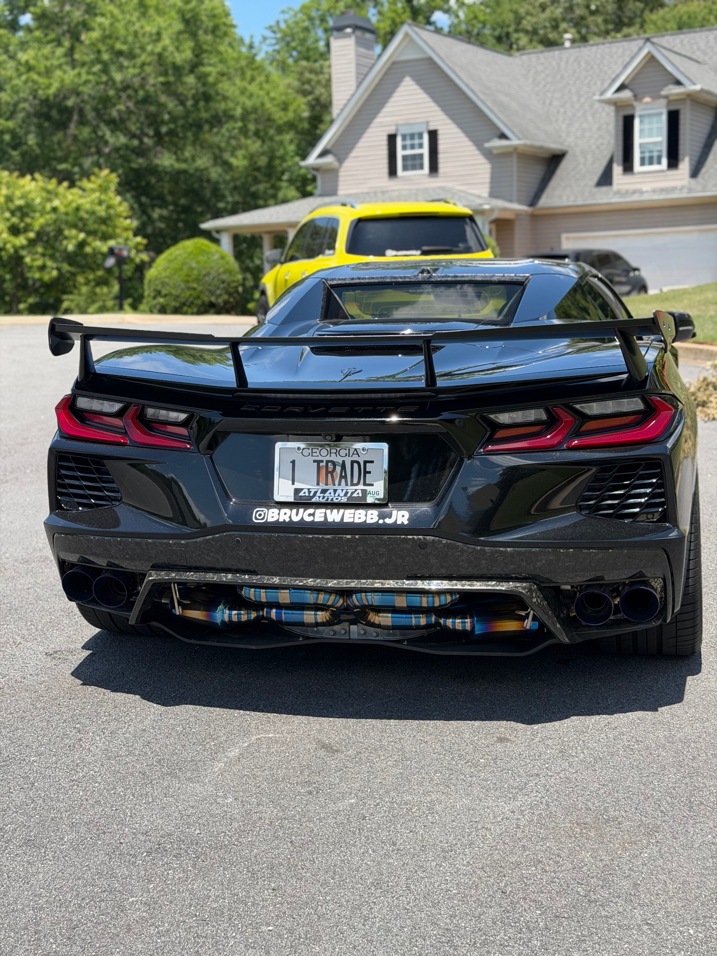 Rear of Bruce Webb's Corvette with @BRUCEWEBB.JR plate